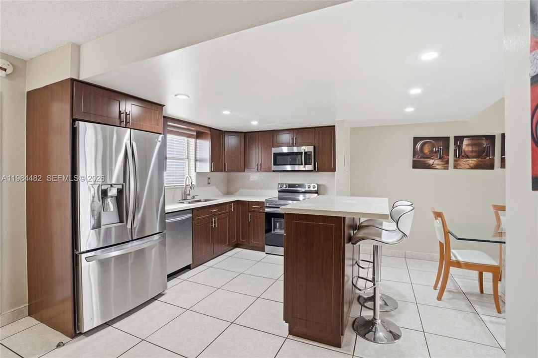 This updated kitchen means business. Modern finishes, ample cabinetry, and generous counter space make cooking a pleasure, not a chore.