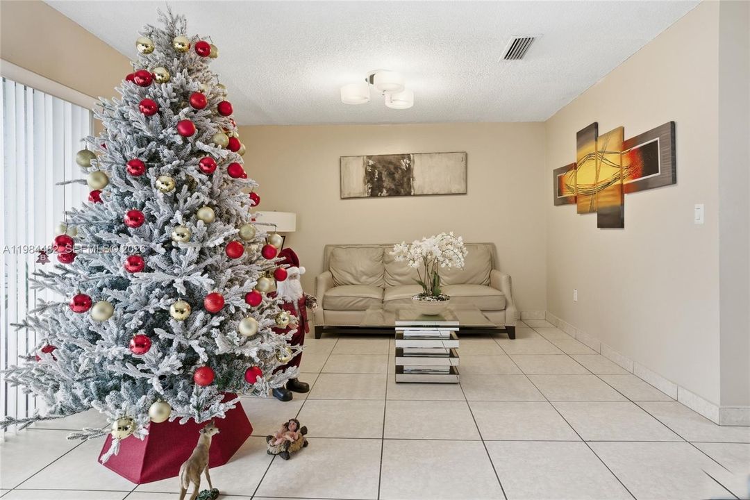 Bright, open, and full of natural light the spacious living area is the heart of this home. High ceilings and an open layout make this the perfect space for relaxing or hosting guests.