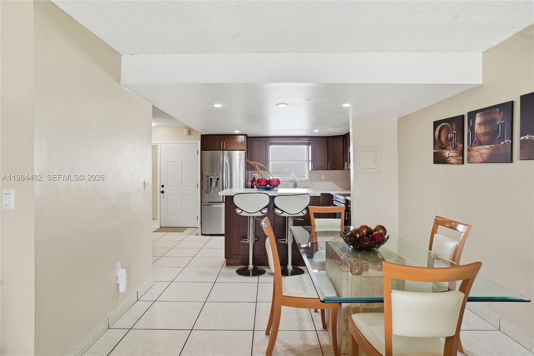 The dining area sits perfectly between the kitchen and living space open, flexible, and ready for everything from casual dinners to lively dinner parties.