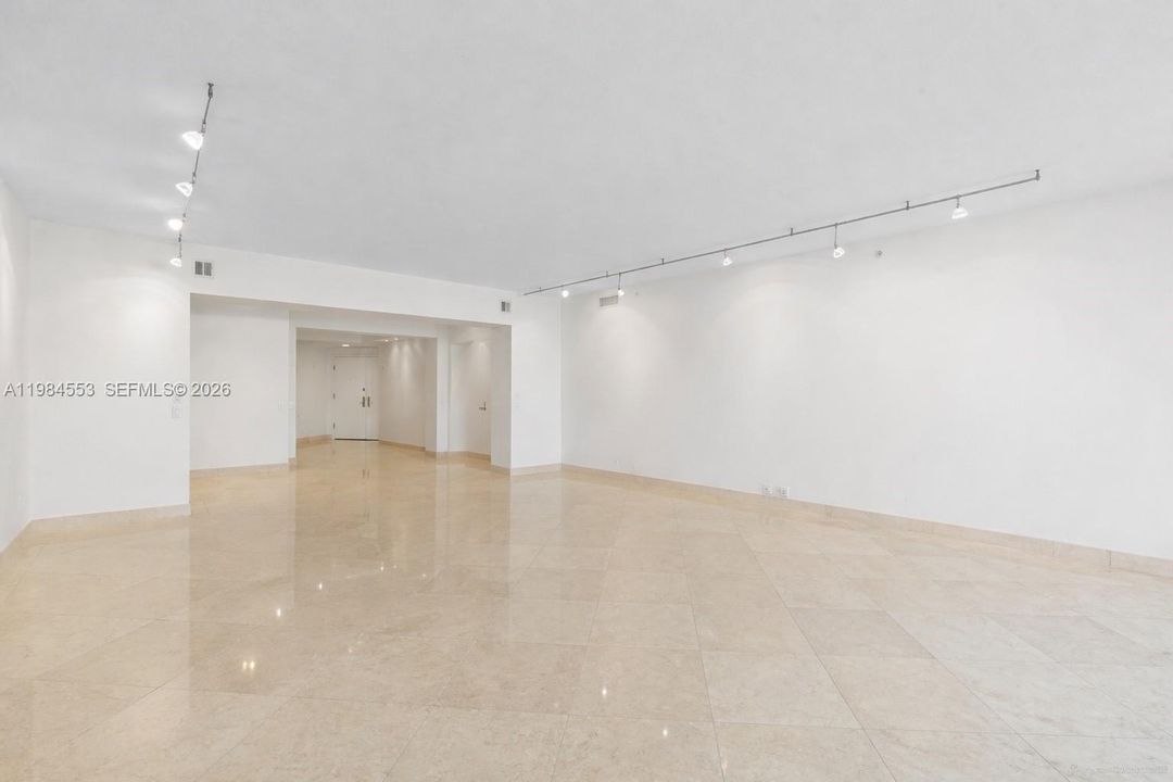 Furniture has been digitally removed to show the space unfurnished