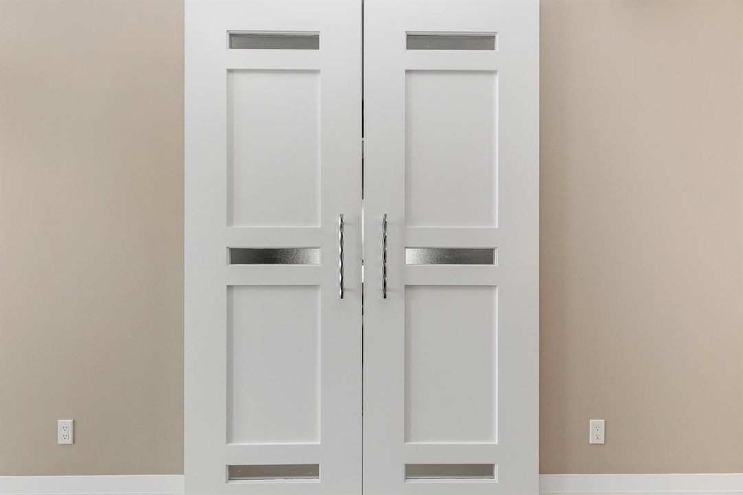CUSTOM BARN DOORS LEADING INTO DEN