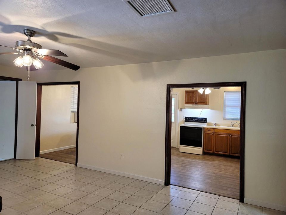LOOKING FROM LIVING ROOM INTO KITCHEN