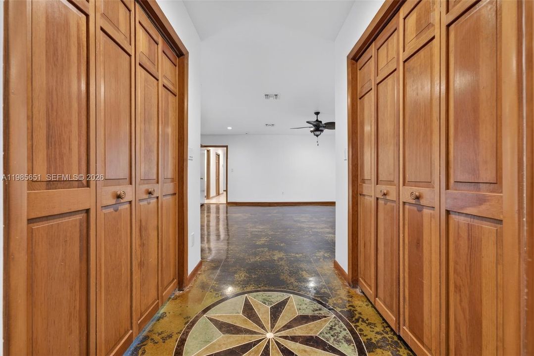 Primary bedroom walk-in closets