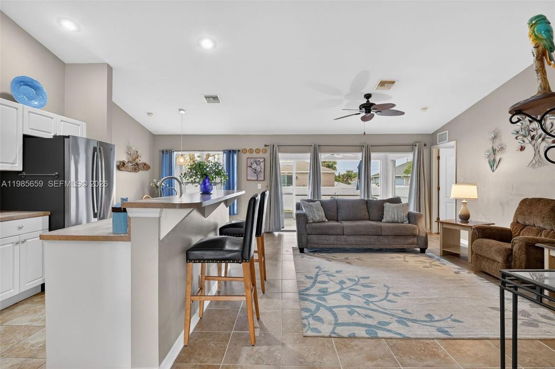 Open layout w/vaulted ceilings and tile flooring