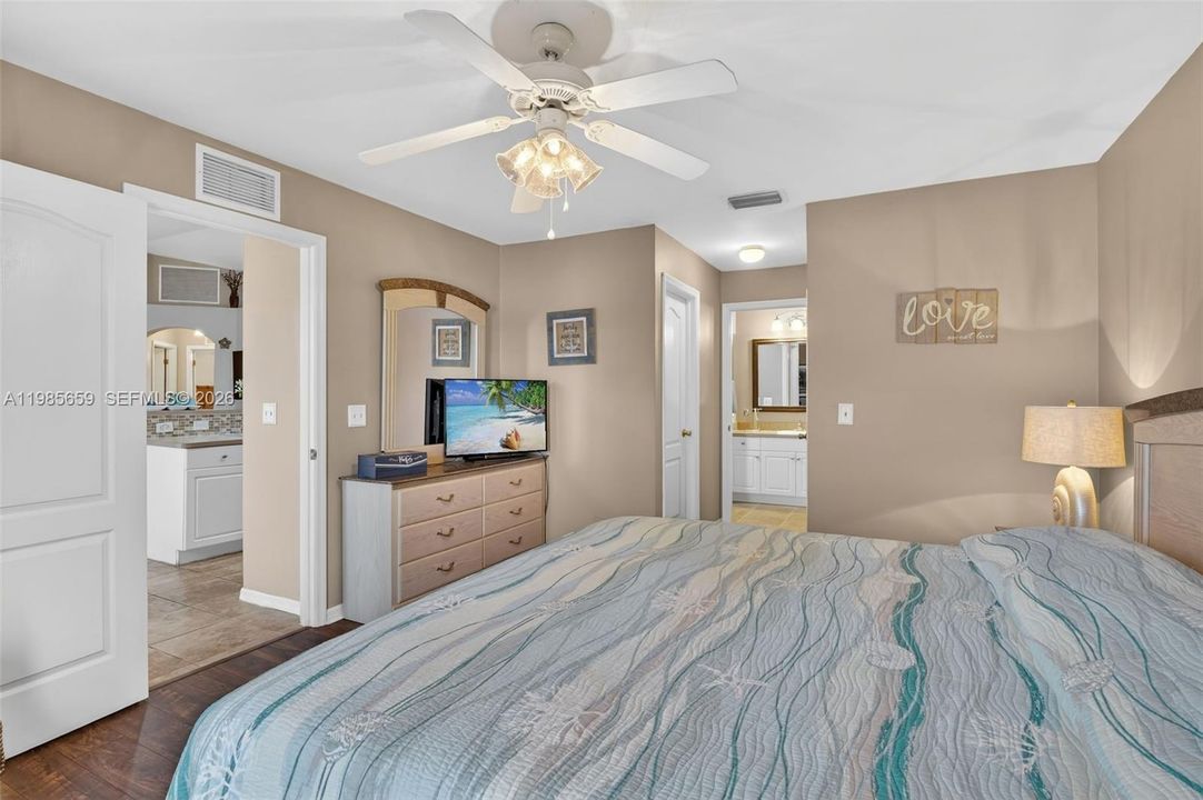 Primary with double walk-in closets and ensuite bathroom