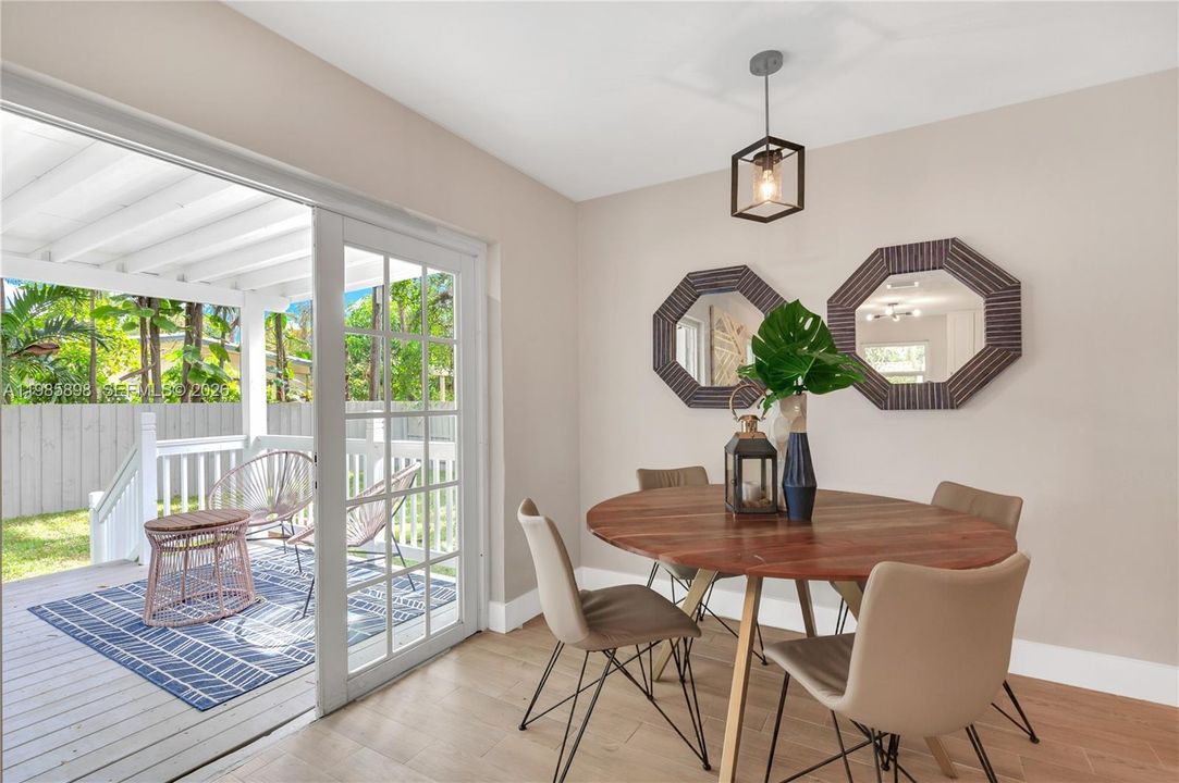 Inviting dining space with seamless indoor-outdoor flow to covered terrace