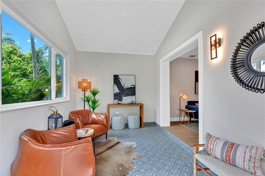 Welcoming, light-filled entry foyer with a cozy seating area