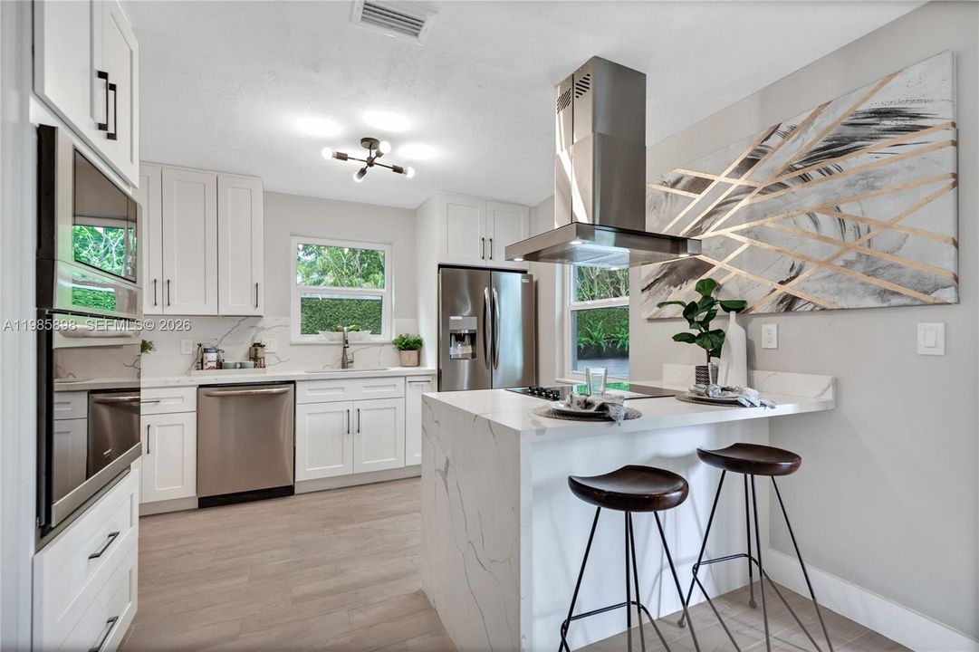 Modern kitchen with island and stainless steel appliances