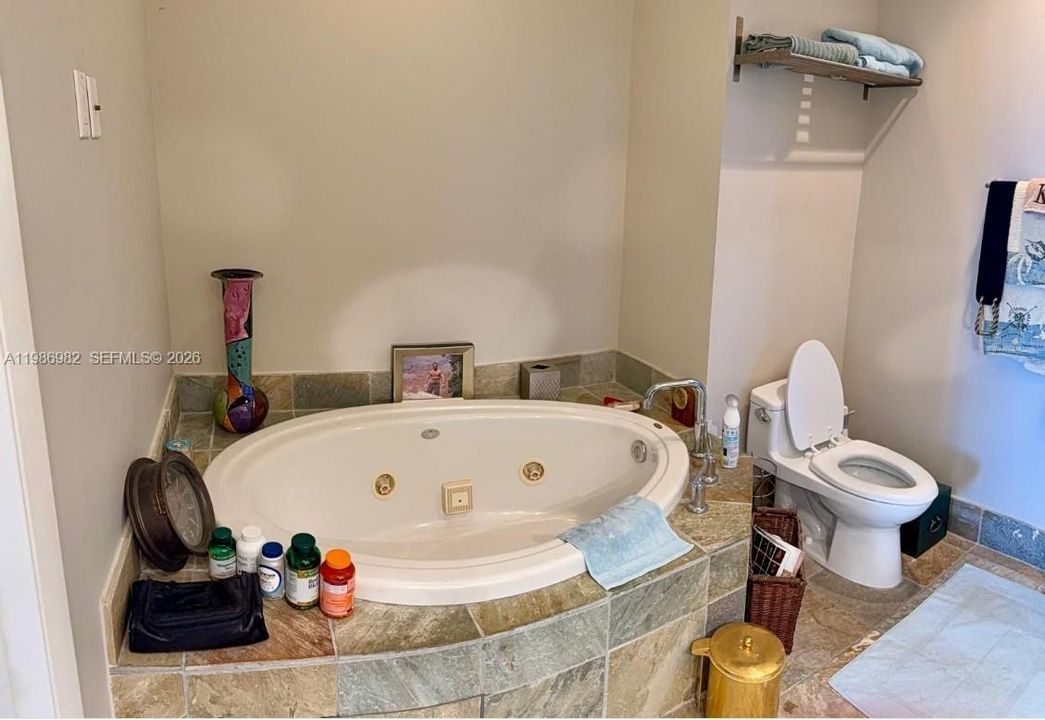 Master bathroom with massaging tub