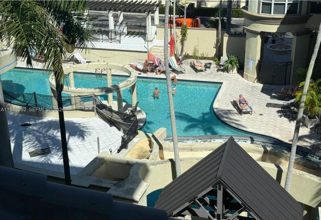 View of outside and the pool as one waits for the elevator.