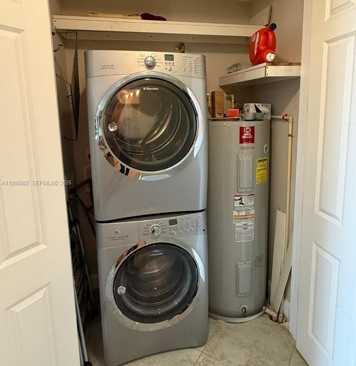 Washer/Dryer and Water Heater across from the kitchen.