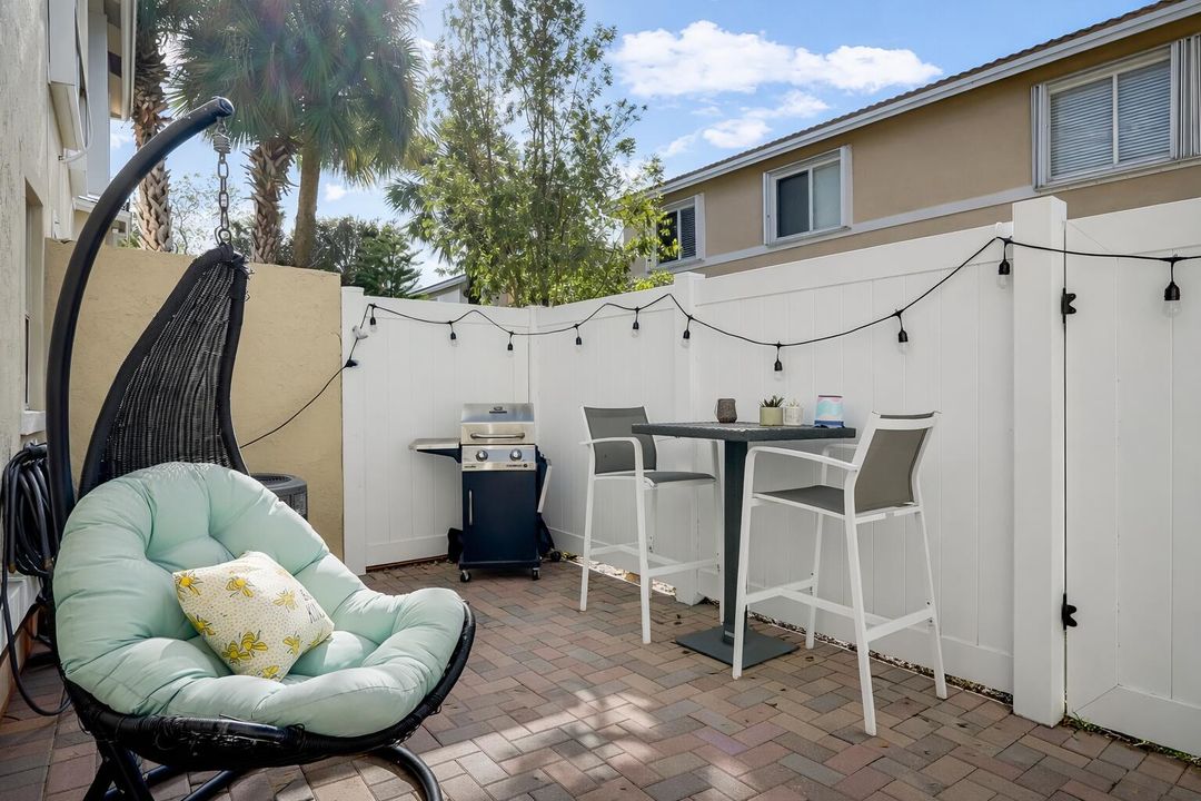 Cozy patio with stylish seating and gril