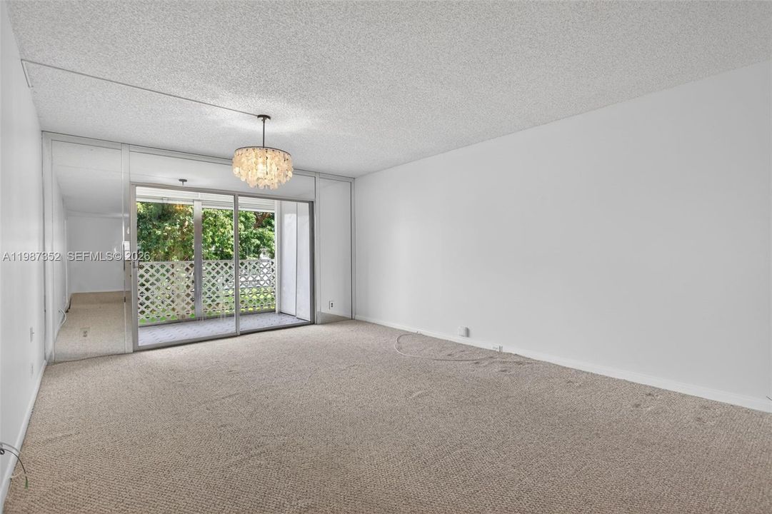 Living room overlooking balcony, green space