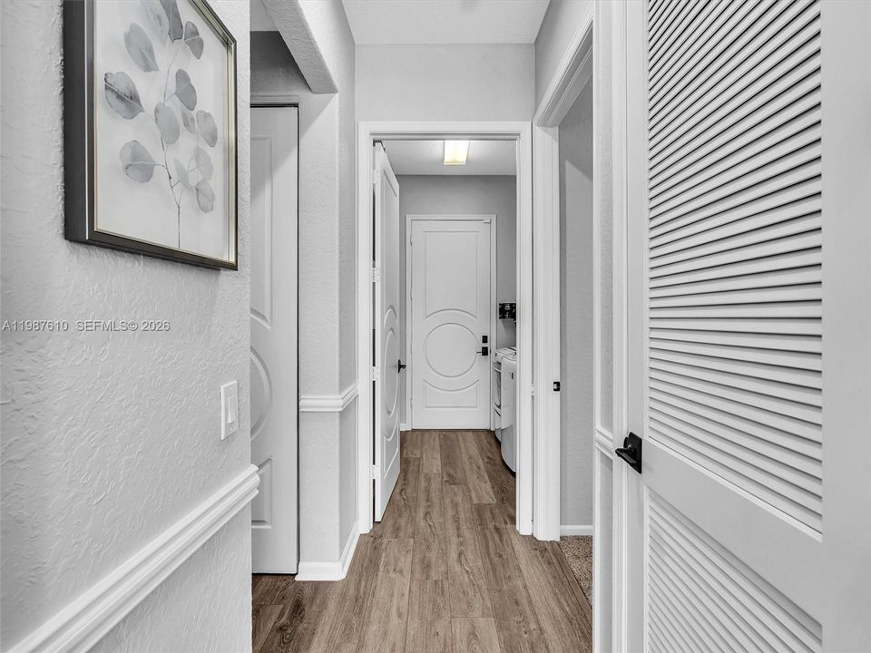 Hallway to downstairs bedroom, bath and laundry room