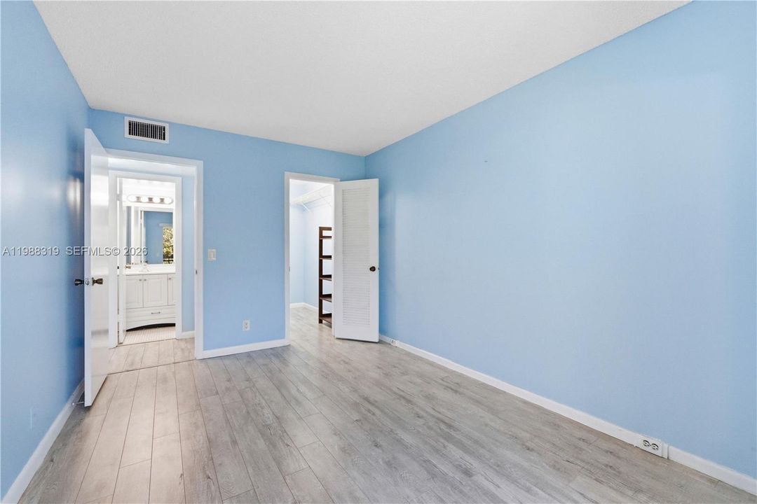 Primary bedroom with walk in closet