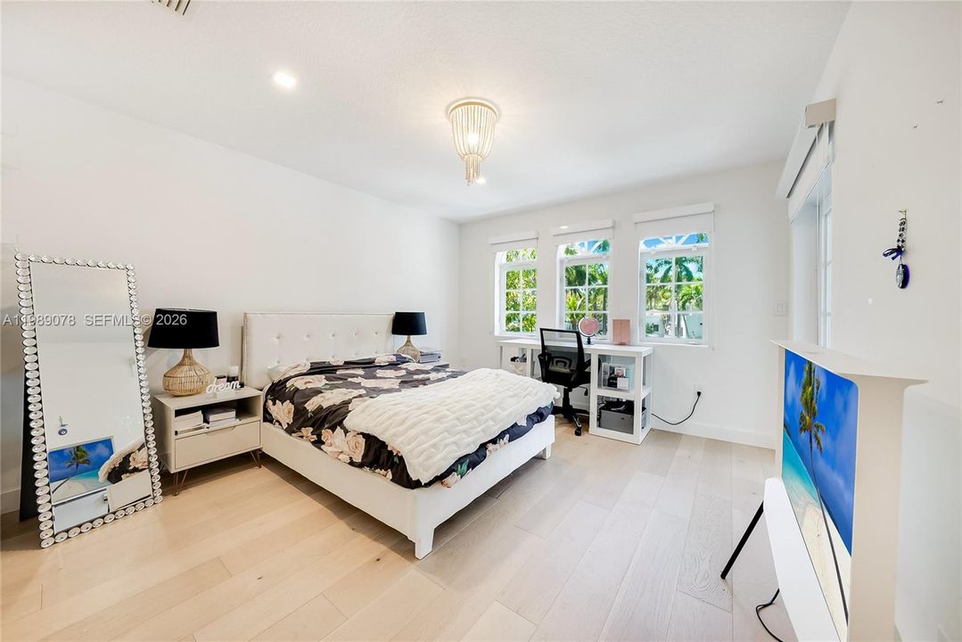 Large corner child's bedroom is expansive, flooded with sunlight, has an ensuite bathroom and Romeo and Juliet balcony