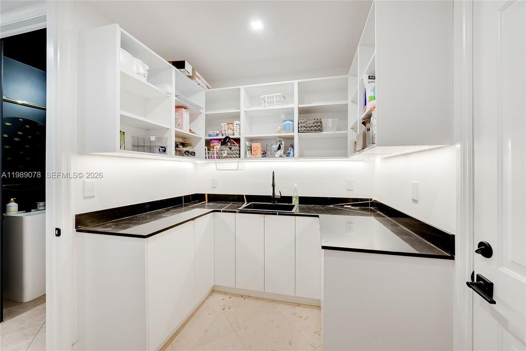 Butler's pantry off two car garage makes for great storage for your large family and easy access to car and home
