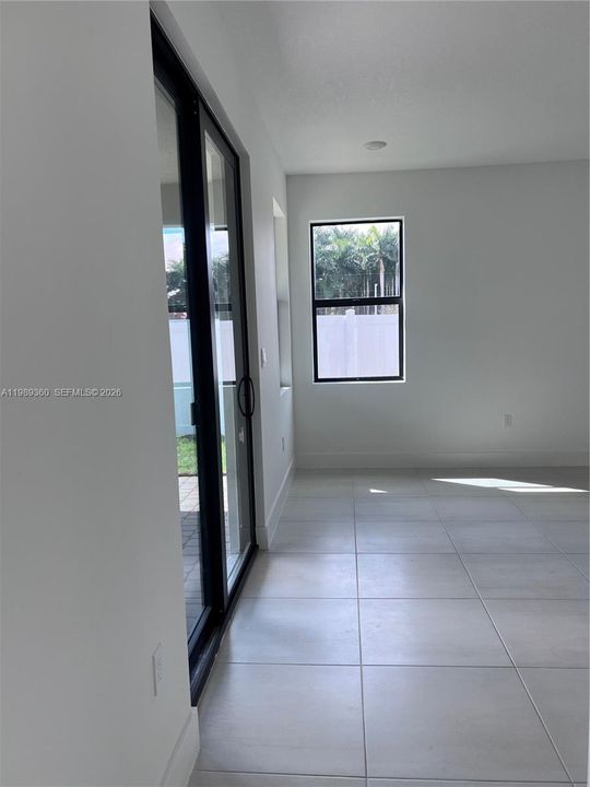Exiting main bedroom toward family room.