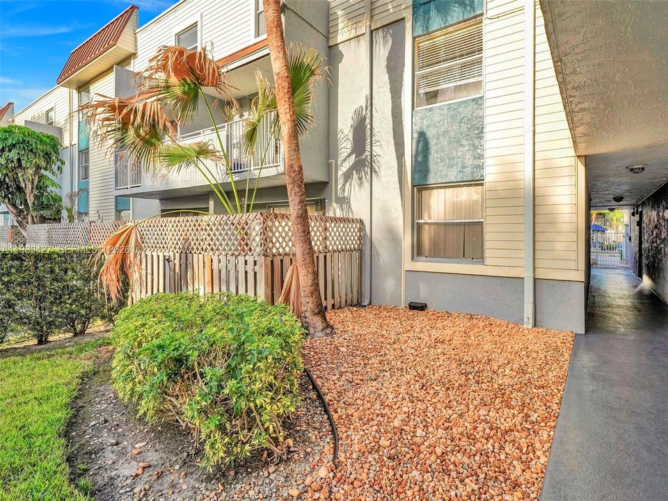 gated patio faces 1 of 2 large parking lots.