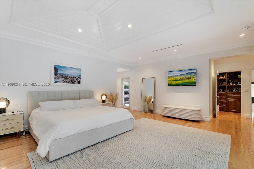 Expansive master bedroom with vaulted ceiling