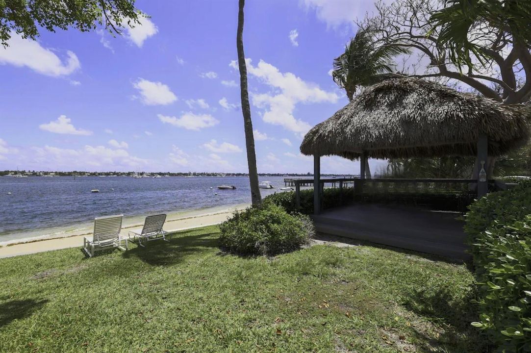 Private beach with tiki hut and commerci