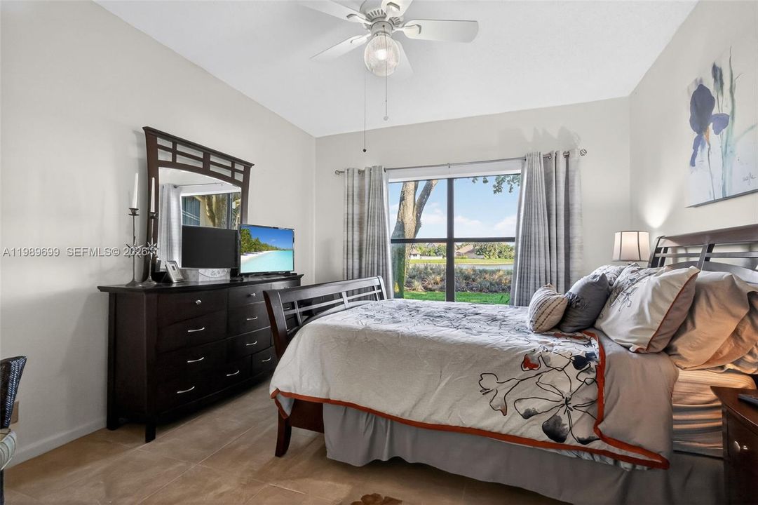 The primary suite offers a large walk-in closet and picturesque views