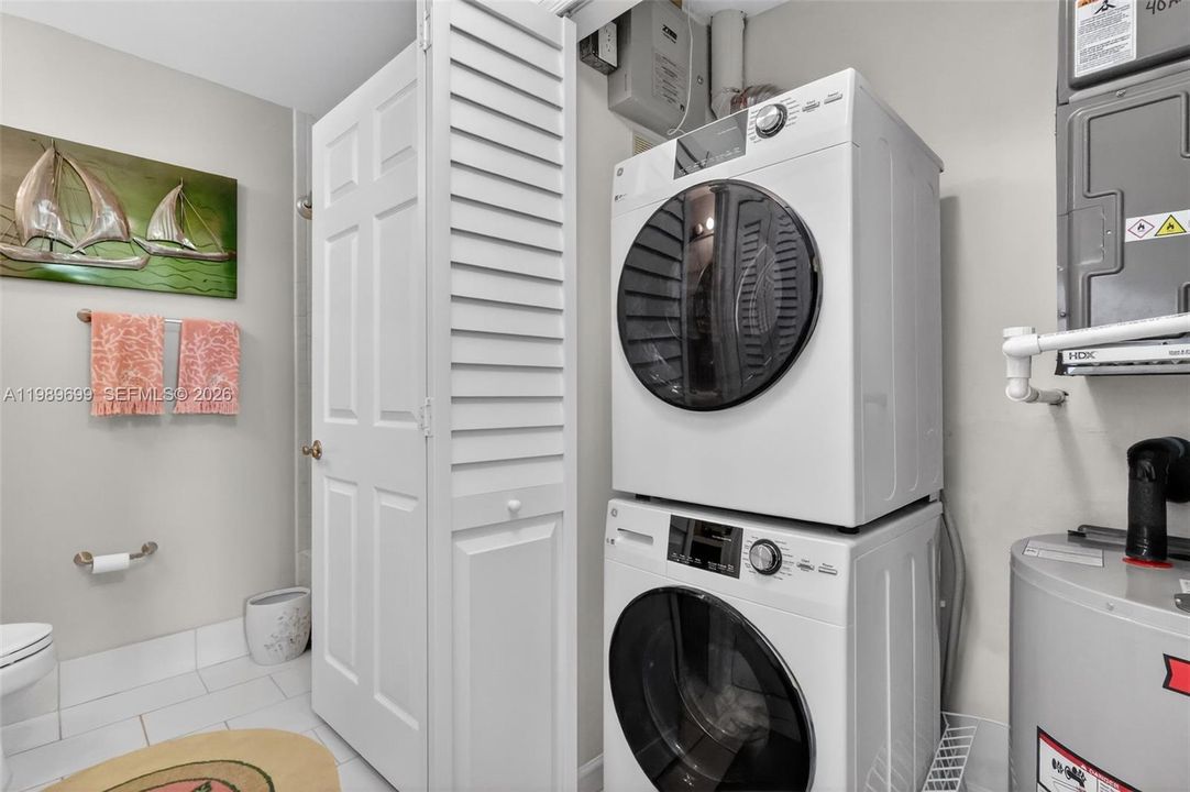 Recent updates include a brand new A/C, hot water heater, and stacked washer and dryer.