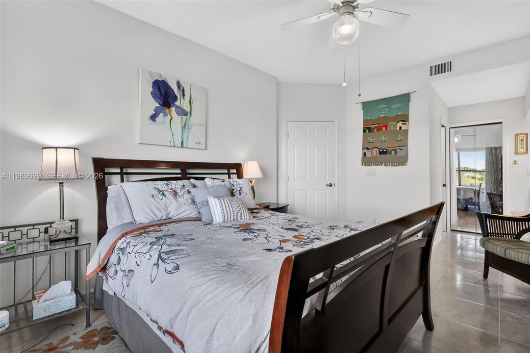 The primary suite offers a large walk-in closet and picturesque views
