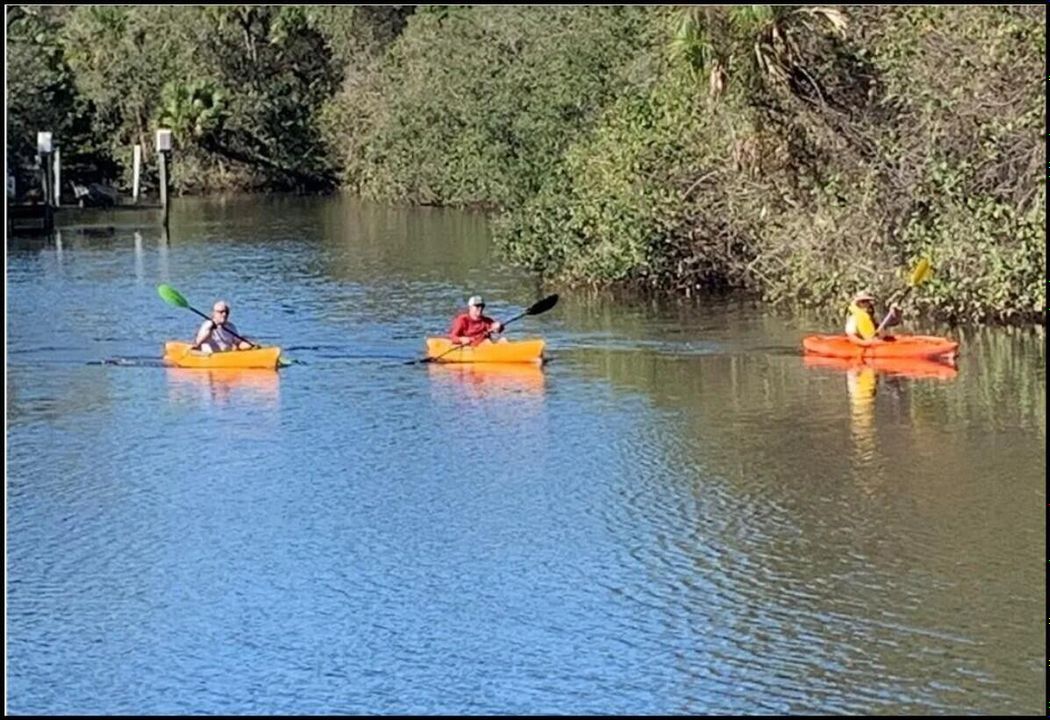3 Kayakers on river