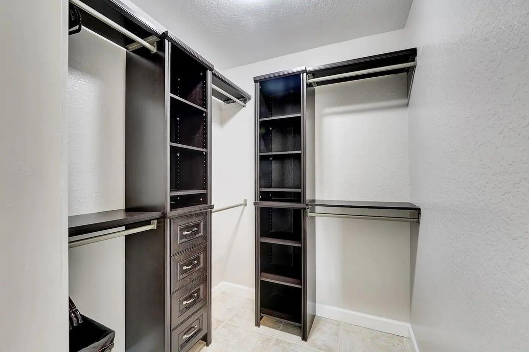 Walk-in Master Closet with Built In Cabi