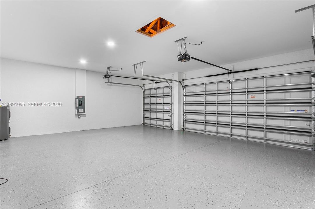Spacious 3-car garage offers ample room for vehicles, storage, and all your Florida lifestyle toys.