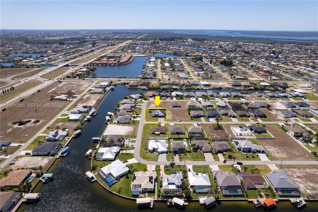 OVERSIZED corner lot NEW CONSTRUCTION CONTEMPORARY home on 0.259 acres in NW Cape Coral PARADISE!