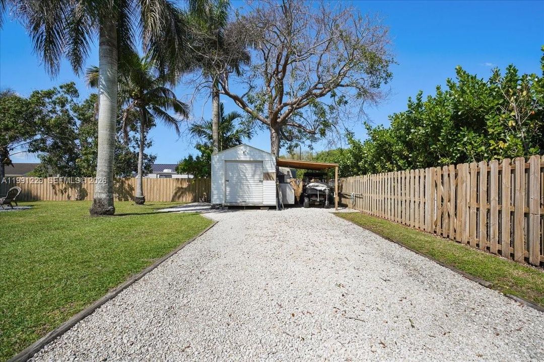 Storage shed behind boat/RV parking