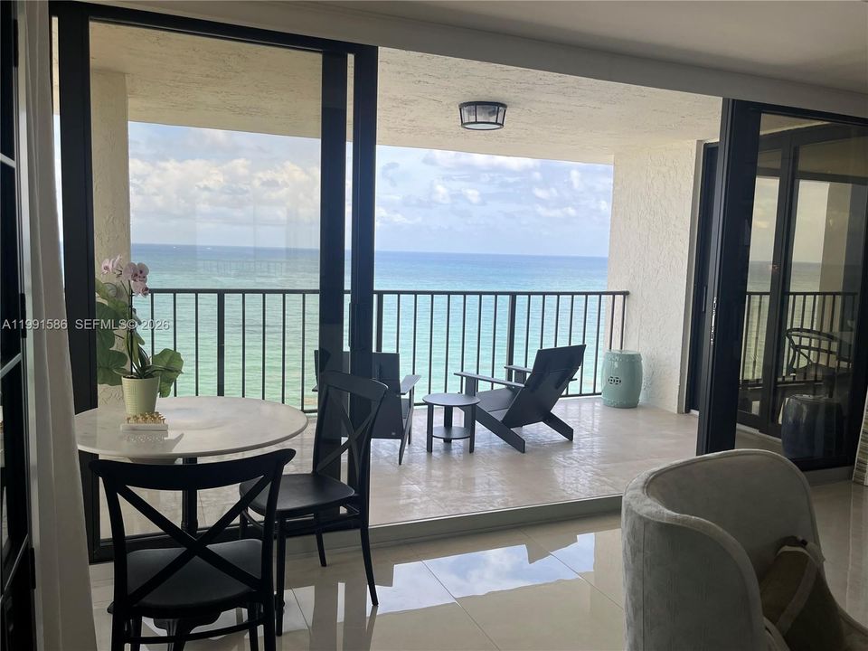 Floor to ceiling impact glass with center sliding doors