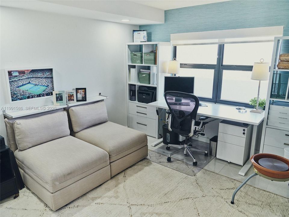 Second bedroom features custom ELFA reach in closet.  Stunning West view of intracoastal.