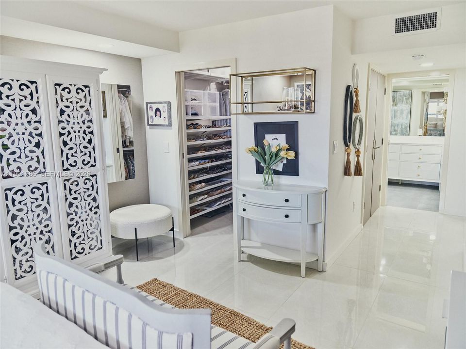 Master bedroom features large custom ELFA walk in closet