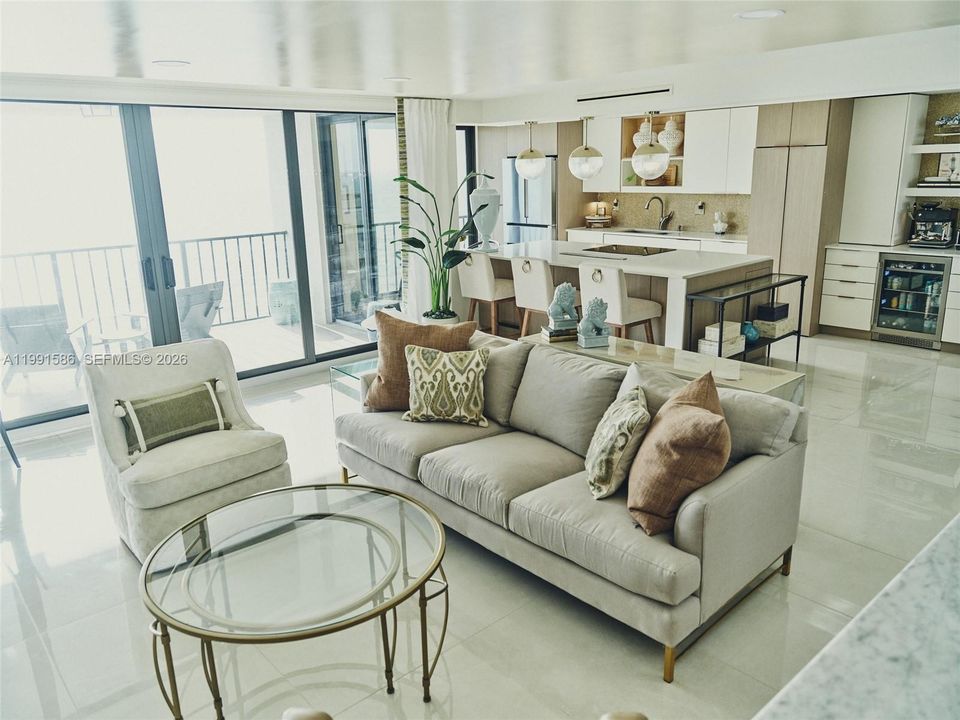 Spacious great room soaks in natural light and views. Features commercial grade porcelain tile throughout, solar shades, soffit ceiling lighting.