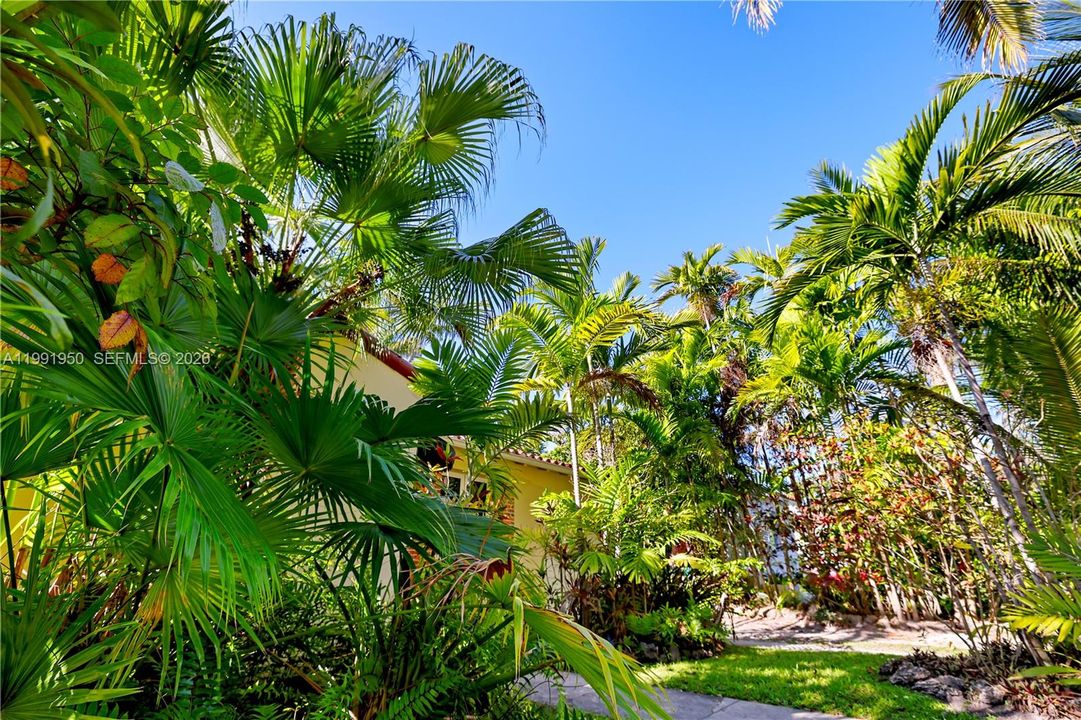 Front exterior with lush landscaping and strong curb appeal