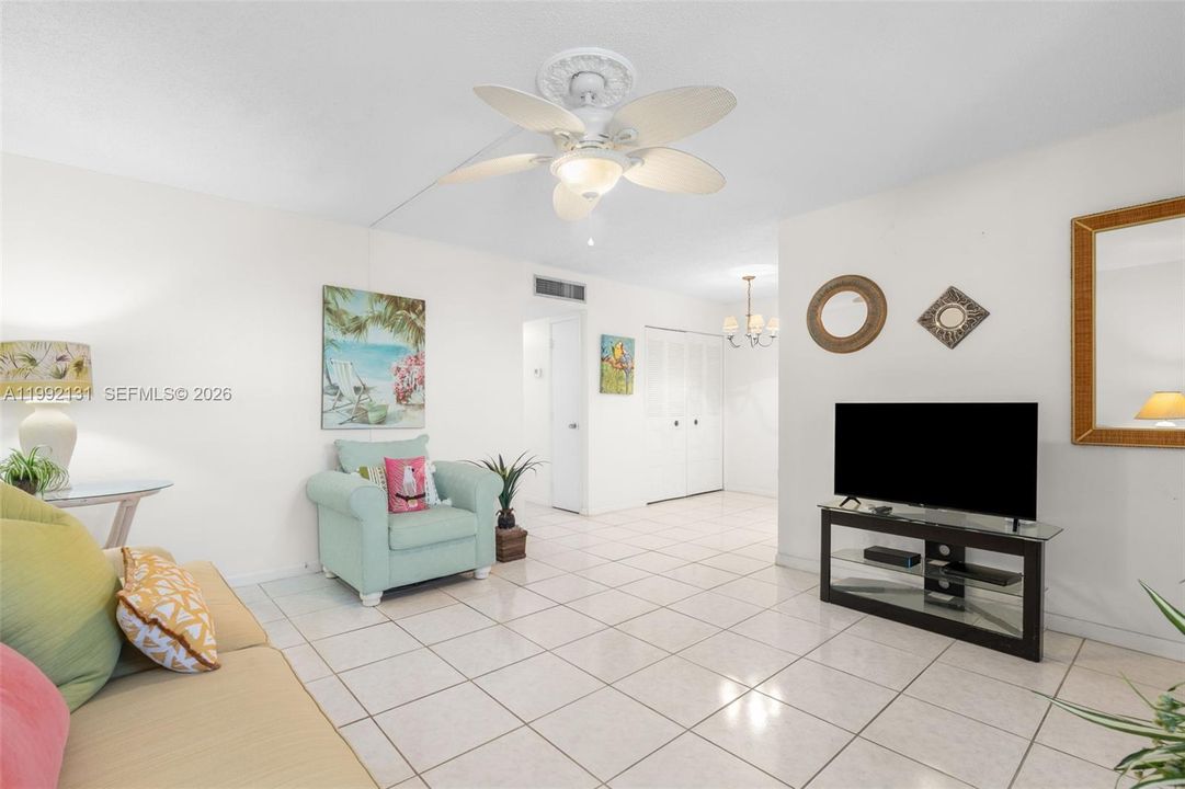 Living room and dining room combination. Tile floors.  Plenty of storage.