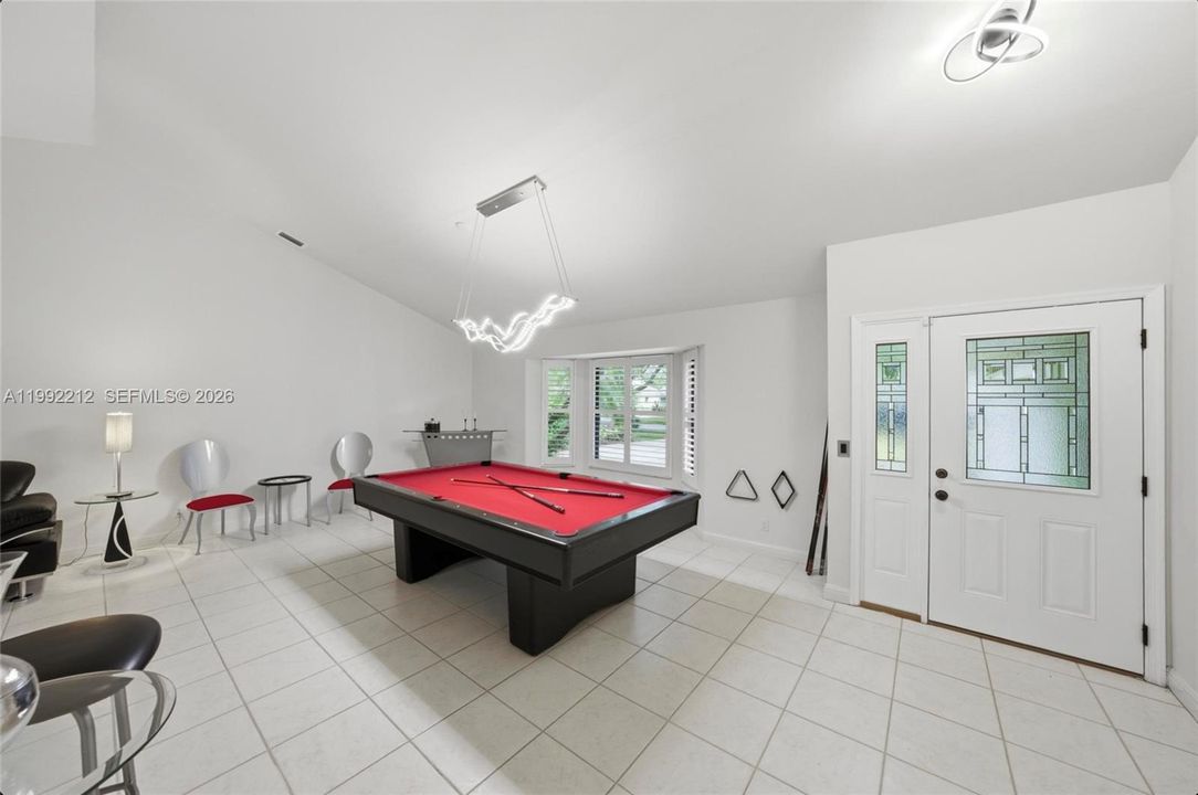 Current Living Room Space has a pool table.