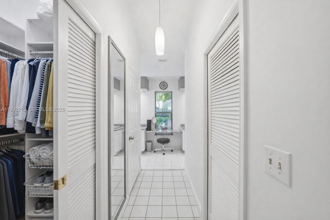 Double walk-in closets. Hallway leads to Primary Bathroom.