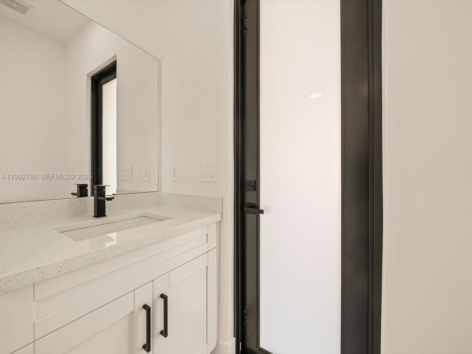 Half-bathroom with exit to patio