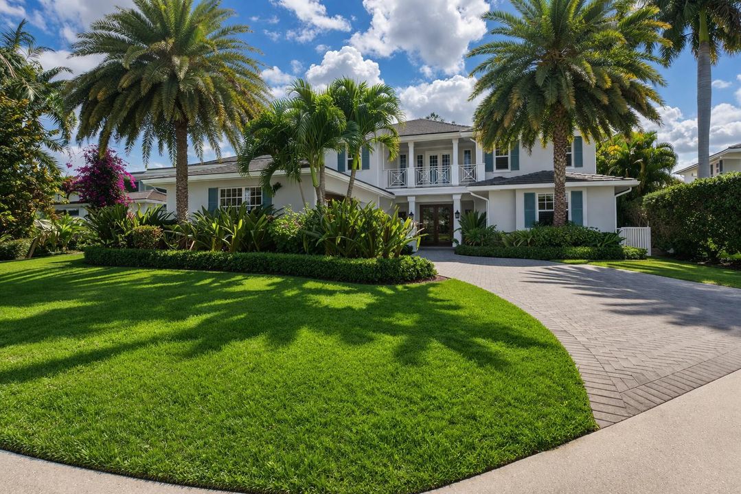 Tropical coastal home with manicured lan
