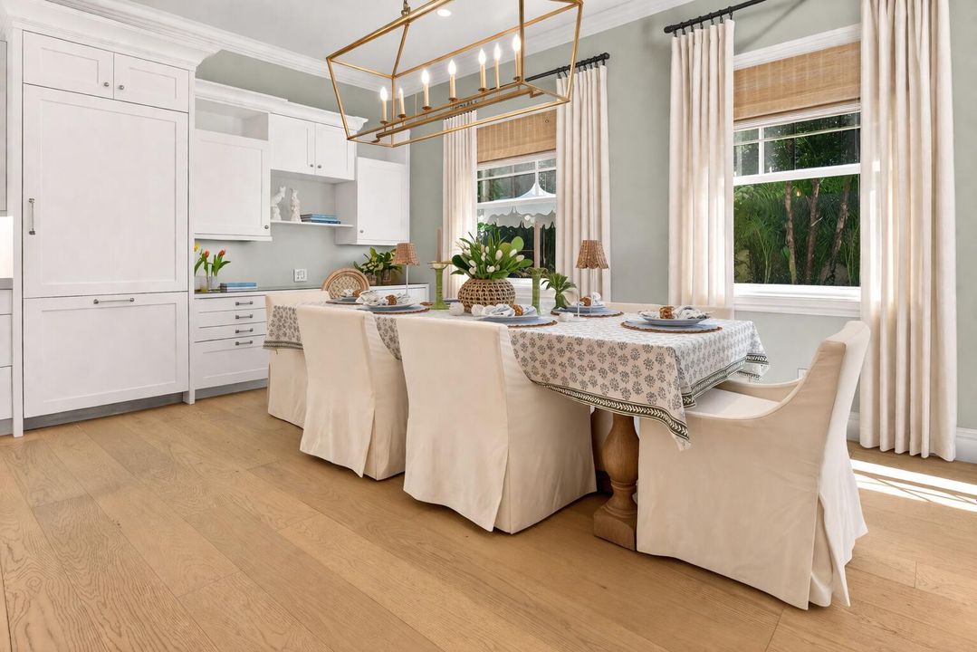 Bright coastal dining nook with greenery