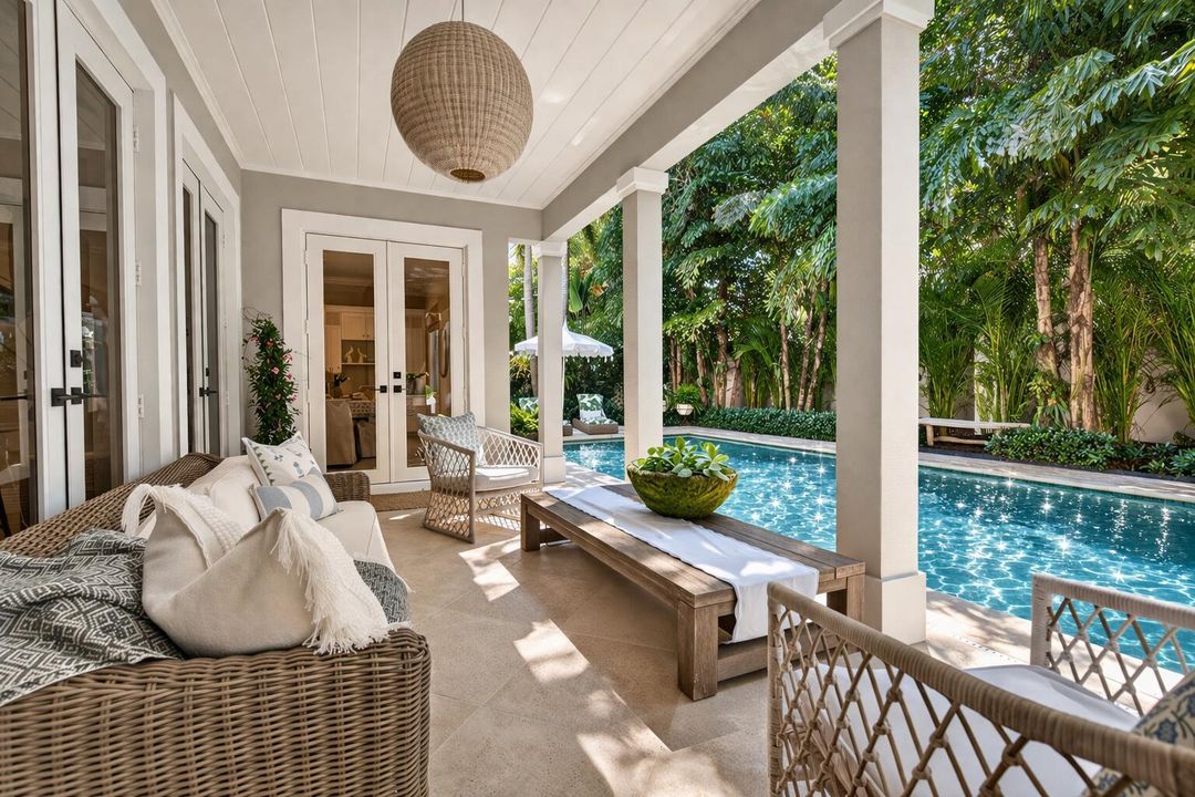 Tropical poolside patio with modern deco