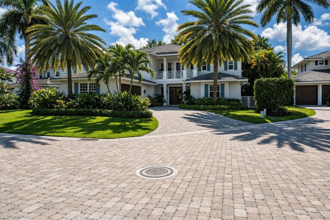 Tropical coastal home with palm trees
