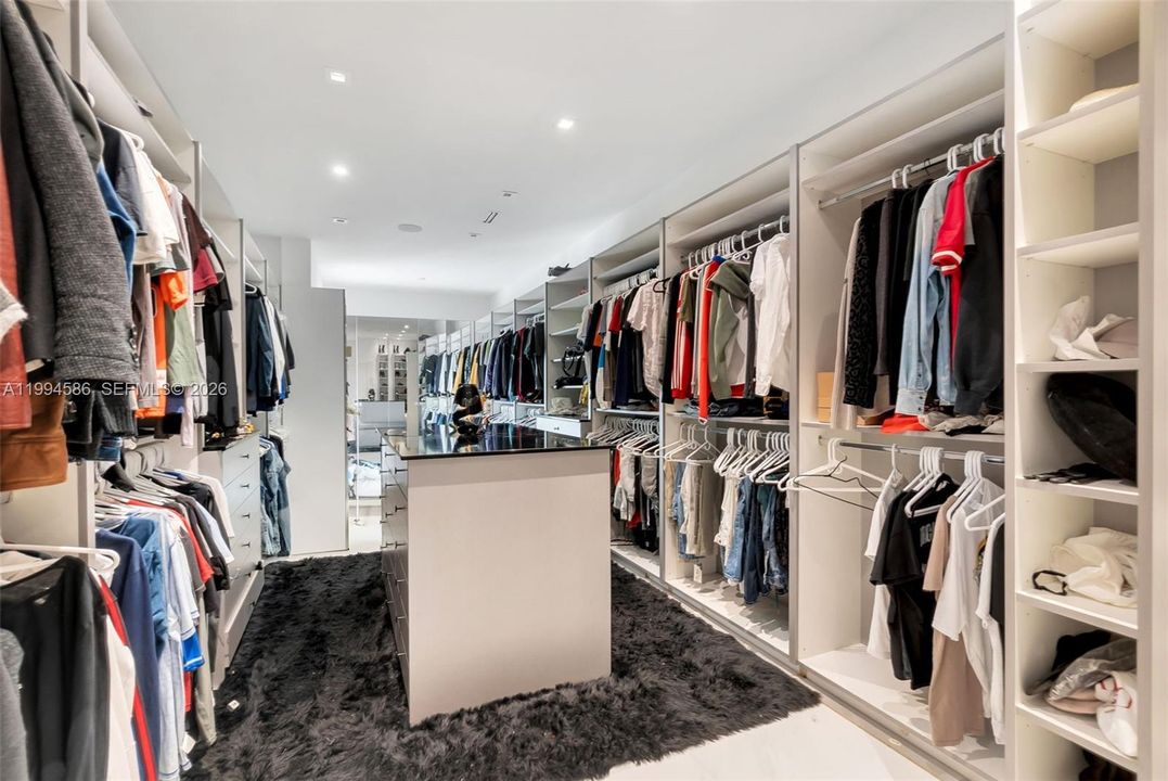 Master bedroom walk-in closet with dual access from bedroom or master bathroom