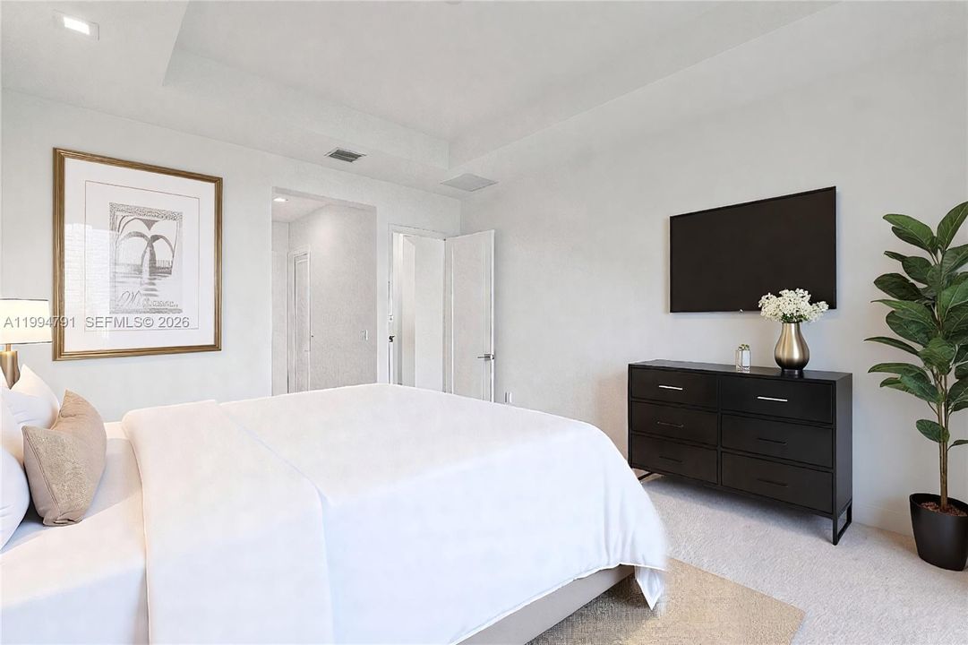 Virtually Staged - Primary bedroom with large ensuite bath and 2 walk-in closets