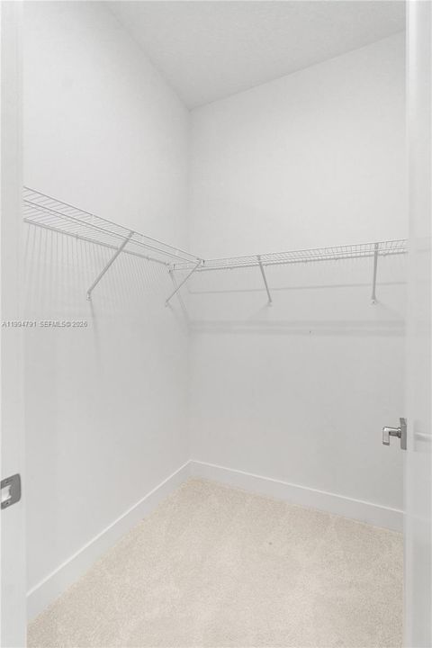 Primary walk-in closet 1 of 2