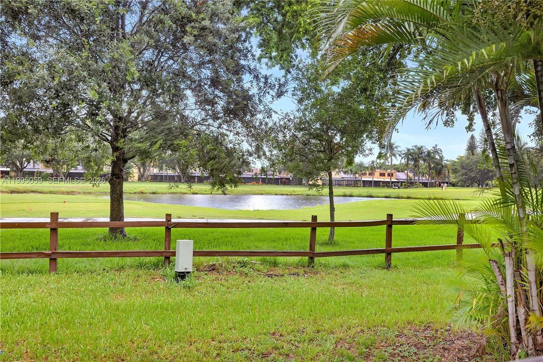 Common Area behind pool fence. Owner an have trees or shrubbery plated for more privacy